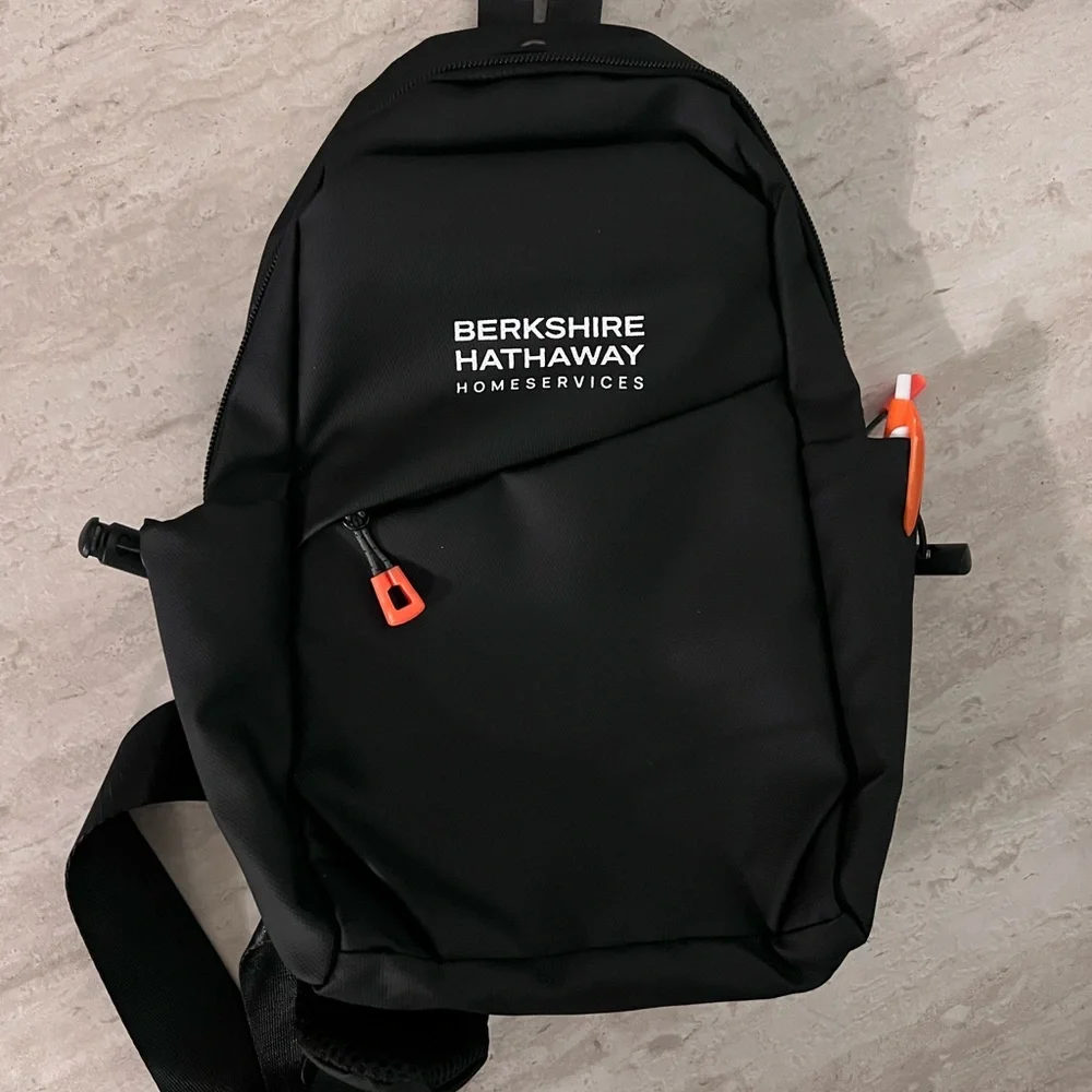 Waterproof Travel Sling Bag- Unisex. Black with Orange accents.